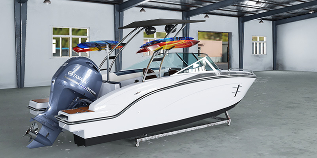 fiberglass boat showroom with sport boat and passenger boat models